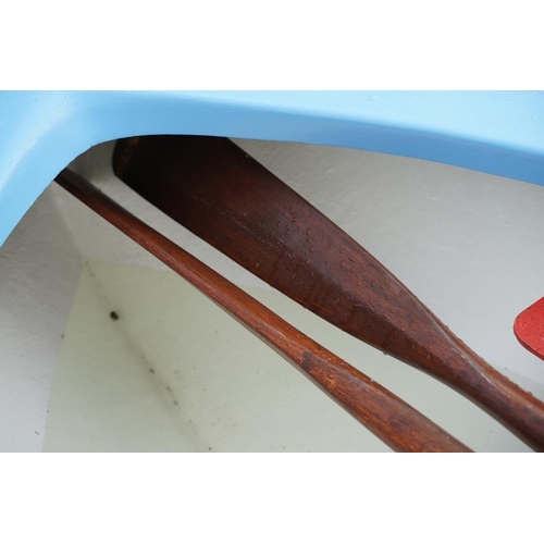 542A - Fibreglass rowing boat in pale blue, with white hull, two sets of oars, three life jackets and road ... 