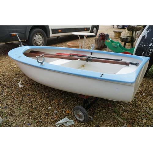 542A - Fibreglass rowing boat in pale blue, with white hull, two sets of oars, three life jackets and road ... 