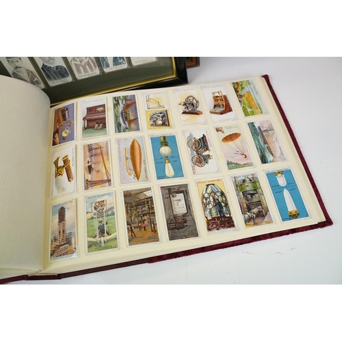 392 - Collection of cigarette cards, to include two albums, framed & loose examples, featuring Players Cri... 