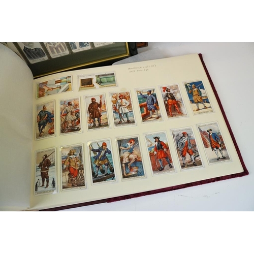 392 - Collection of cigarette cards, to include two albums, framed & loose examples, featuring Players Cri... 