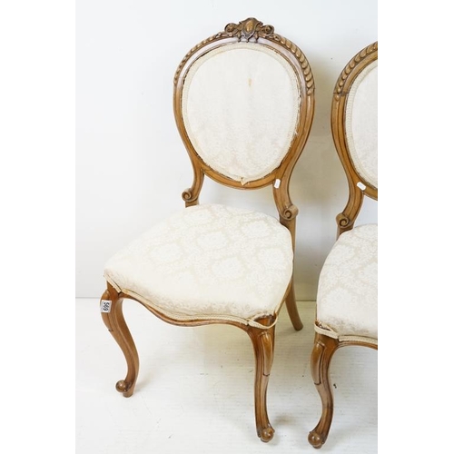 569 - Set of Six French style Dining Chairs with carved walnut frames, upholstered oval backs and stuff ov... 