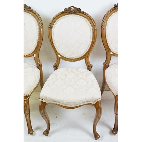 569 - Set of Six French style Dining Chairs with carved walnut frames, upholstered oval backs and stuff ov... 