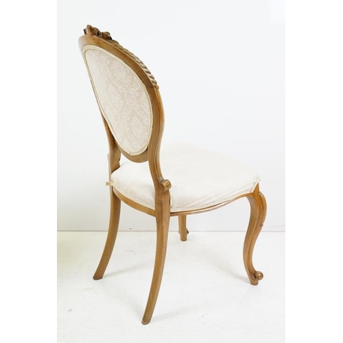 569 - Set of Six French style Dining Chairs with carved walnut frames, upholstered oval backs and stuff ov... 