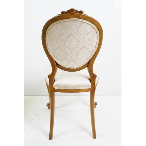 569 - Set of Six French style Dining Chairs with carved walnut frames, upholstered oval backs and stuff ov... 