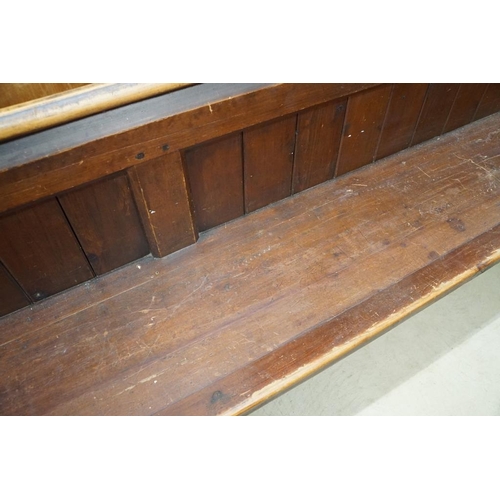 581 - Late 19th / Early 20th century Long Pine Church or Chapel Pew, housing a lockable box under seat, wi... 