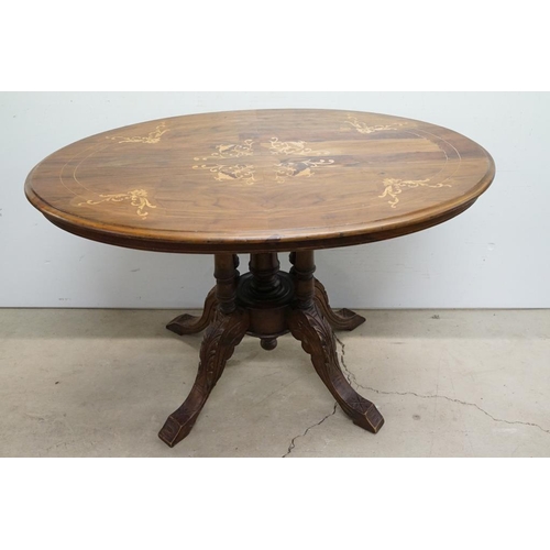 584 - Victorian Walnut and Marquetry Inlaid Oval Tilt Top Loo Table, raised on five turned column supports... 