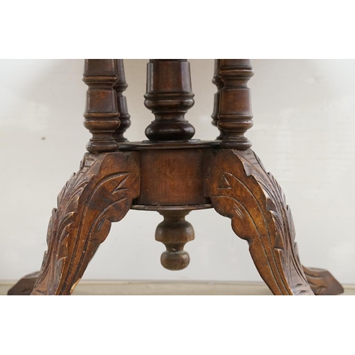 584 - Victorian Walnut and Marquetry Inlaid Oval Tilt Top Loo Table, raised on five turned column supports... 