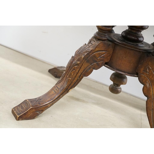 584 - Victorian Walnut and Marquetry Inlaid Oval Tilt Top Loo Table, raised on five turned column supports... 