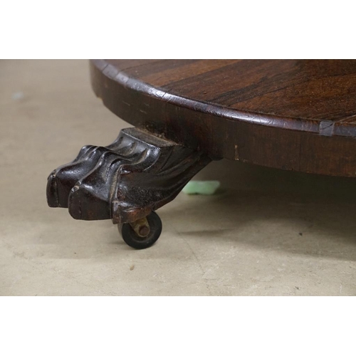 587 - Victorian Rosewood Circular Tilt Top Breakfast Table raised on a bulbous octagonal column and a circ... 