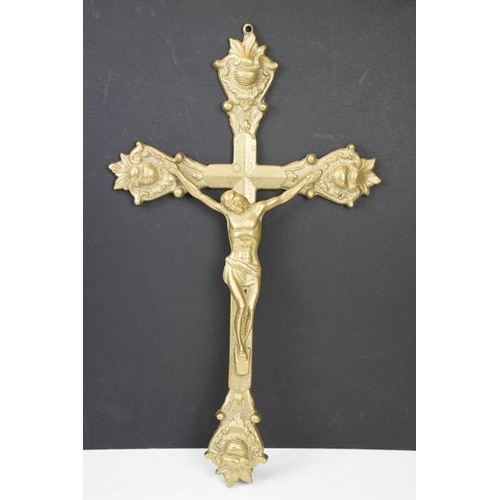 402 - Two brass crucifixes (the largest approx 34cm high); together with two carved wooden religious figur... 