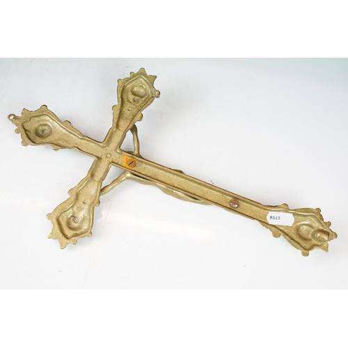 402 - Two brass crucifixes (the largest approx 34cm high); together with two carved wooden religious figur... 