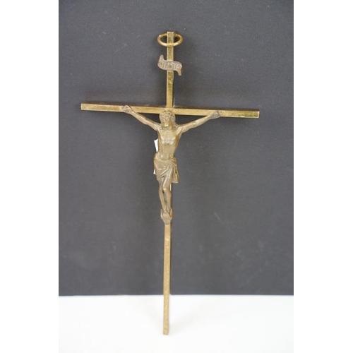 402 - Two brass crucifixes (the largest approx 34cm high); together with two carved wooden religious figur... 