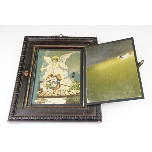 403 - French folding travel mirror with printed scenes depicting an angel and two children, the wooden fra... 