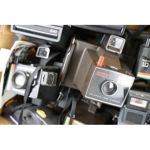 409 - A large collection of Polaroid Instant cameras to include a Polaroid 600, Impulse and various SX-70 ... 