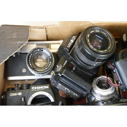 411 - Collection of SLR and 35mm film cameras with lenses, featuring Canon, Olympus, Pentax and Minolta ex... 