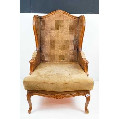 612 - French style Wing Back Bergere Armchair with upholstered cushion seat, raised on short cabriole legs... 