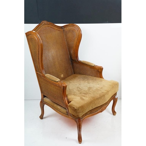 612 - French style Wing Back Bergere Armchair with upholstered cushion seat, raised on short cabriole legs... 