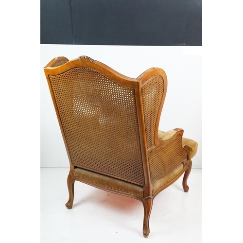 612 - French style Wing Back Bergere Armchair with upholstered cushion seat, raised on short cabriole legs... 