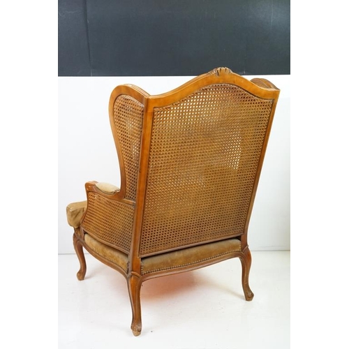 612 - French style Wing Back Bergere Armchair with upholstered cushion seat, raised on short cabriole legs... 