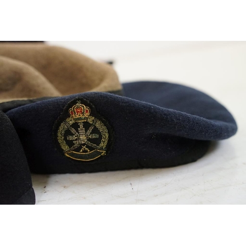 413 - Collection of 20 military caps and berets with associated badges to include Serbia Air Force, Vietna... 