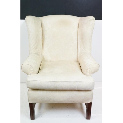 623 - Georgian style Wing Back Armchair with cream upholstery and H-stretcher, 84cm wide x 88cm deep x 106... 