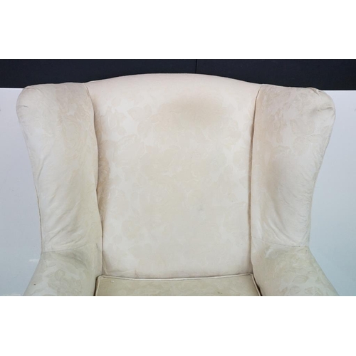 623 - Georgian style Wing Back Armchair with cream upholstery and H-stretcher, 84cm wide x 88cm deep x 106... 