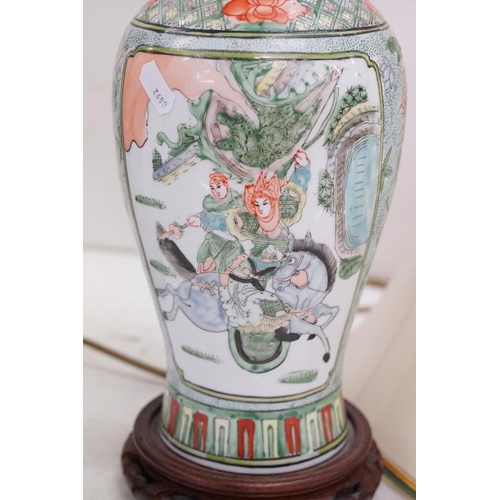 420 - Chinese Famille Verte converted vase lamp base with panels depicting warriors and a horse, raised on... 