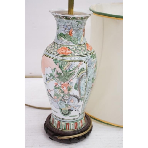 420 - Chinese Famille Verte converted vase lamp base with panels depicting warriors and a horse, raised on... 