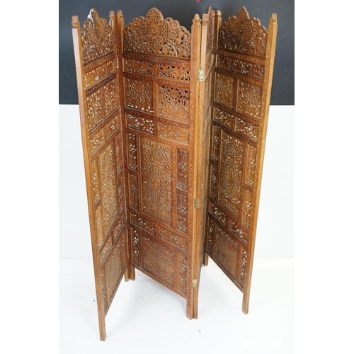 637 - Indian Hardwood four-fold Dressing Screen with profuse pierced floral carving throughout, each panel... 