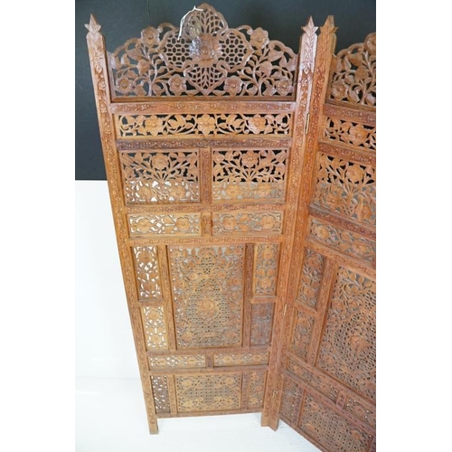 637 - Indian Hardwood four-fold Dressing Screen with profuse pierced floral carving throughout, each panel... 