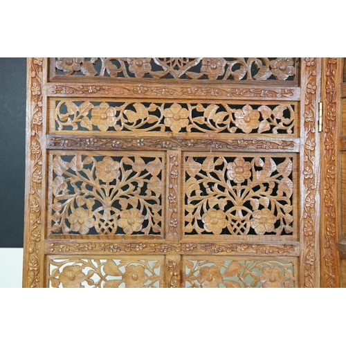 637 - Indian Hardwood four-fold Dressing Screen with profuse pierced floral carving throughout, each panel... 