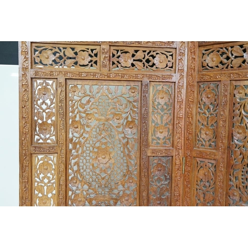 637 - Indian Hardwood four-fold Dressing Screen with profuse pierced floral carving throughout, each panel... 