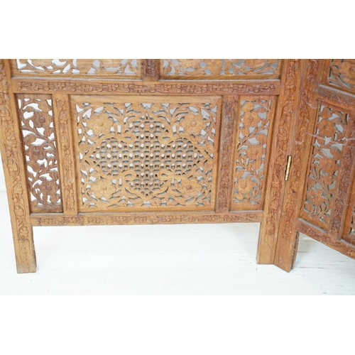 637 - Indian Hardwood four-fold Dressing Screen with profuse pierced floral carving throughout, each panel... 