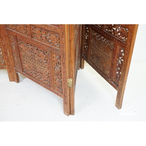 637 - Indian Hardwood four-fold Dressing Screen with profuse pierced floral carving throughout, each panel... 