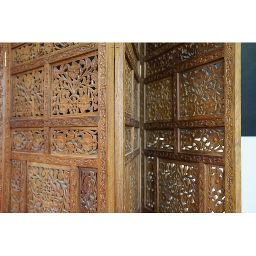 637 - Indian Hardwood four-fold Dressing Screen with profuse pierced floral carving throughout, each panel... 