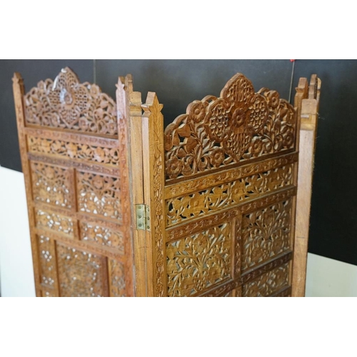 637 - Indian Hardwood four-fold Dressing Screen with profuse pierced floral carving throughout, each panel... 