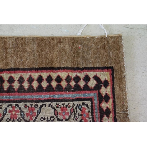 573 - Serab Runner with diamond lozenge and flowerhead field within a camel outer border, cut and reduced,... 