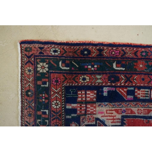 578 - Persian Wool Rug, the red ground with a geometric pattern within a border, 238cm x 160cm