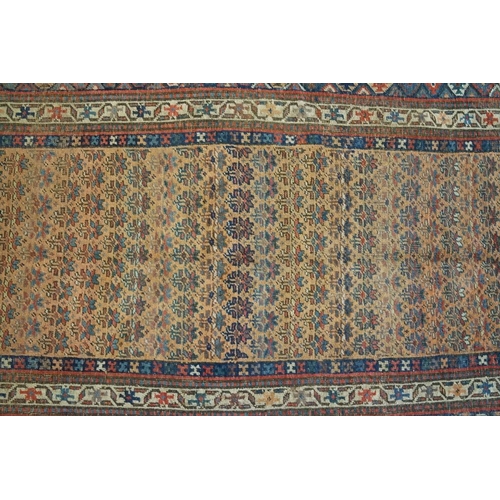 579 - North-West Persian Corridor Carpet, the rust brown field with rows of flowers, within an indigo meda... 