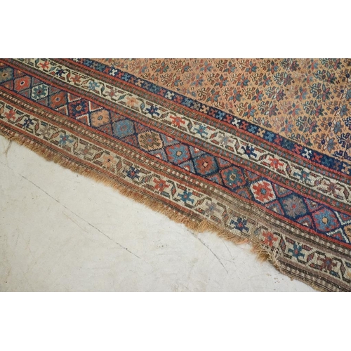 579 - North-West Persian Corridor Carpet, the rust brown field with rows of flowers, within an indigo meda... 