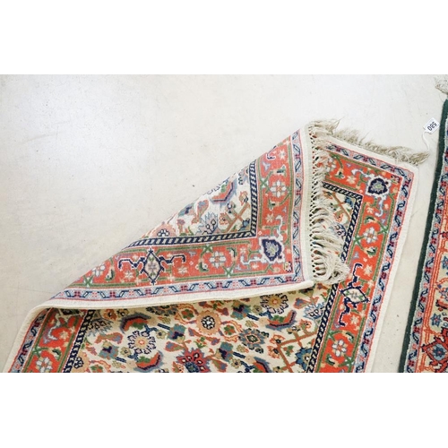 580 - Green ground Runner Rug, 199cm x 72cm together with Pink and Cream ground Runner Rug, 163cm x 71cm