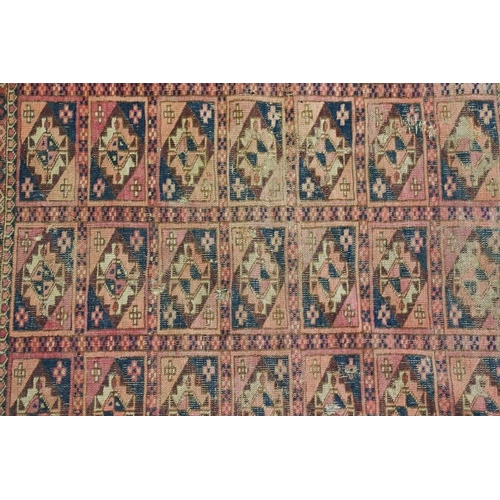 605 - Turkoman Rug with four rows of seven guls, worn, 105cm x 99cm