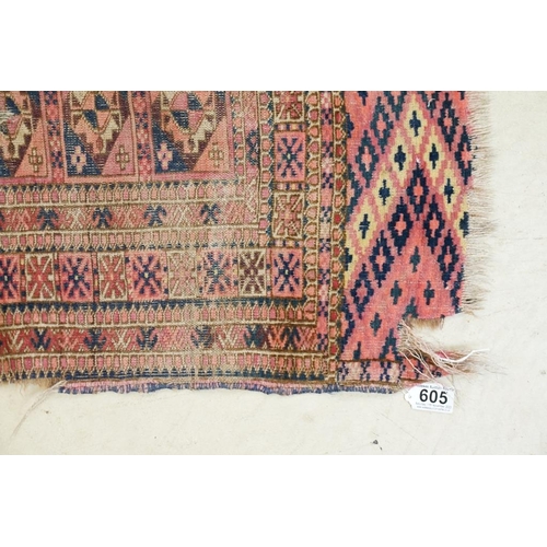 605 - Turkoman Rug with four rows of seven guls, worn, 105cm x 99cm