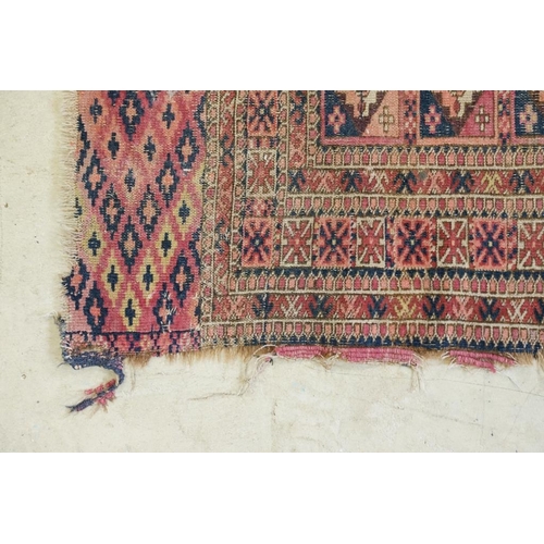 605 - Turkoman Rug with four rows of seven guls, worn, 105cm x 99cm