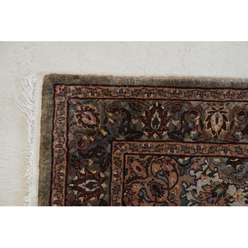 606 - Part Silk Rug with floral pattern on a cream and green ground, 79cm x 126cm