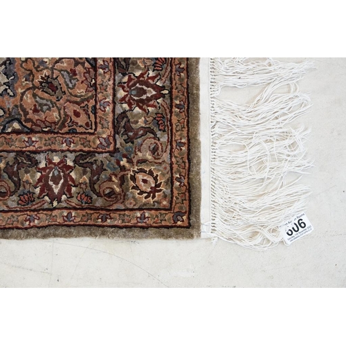 606 - Part Silk Rug with floral pattern on a cream and green ground, 79cm x 126cm