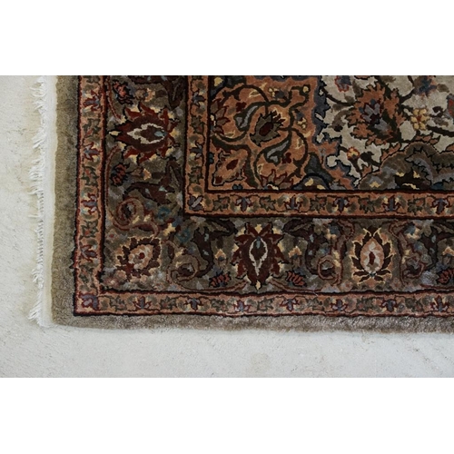 606 - Part Silk Rug with floral pattern on a cream and green ground, 79cm x 126cm