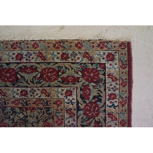 640 - Kerman Rug with all-over red roses, flowers and leaves, highlights of indigo, the border with entwin... 