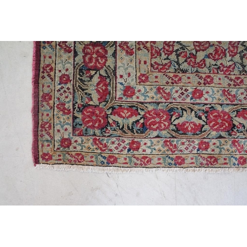 640 - Kerman Rug with all-over red roses, flowers and leaves, highlights of indigo, the border with entwin... 