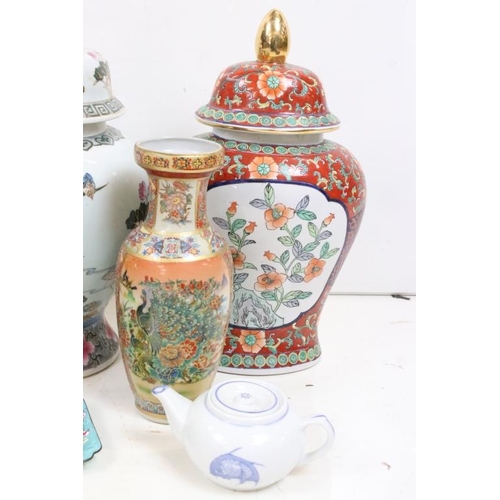 158 - Collection of oriental ceramics to include a pair of lidded vases with lotus flower detailing, assor... 